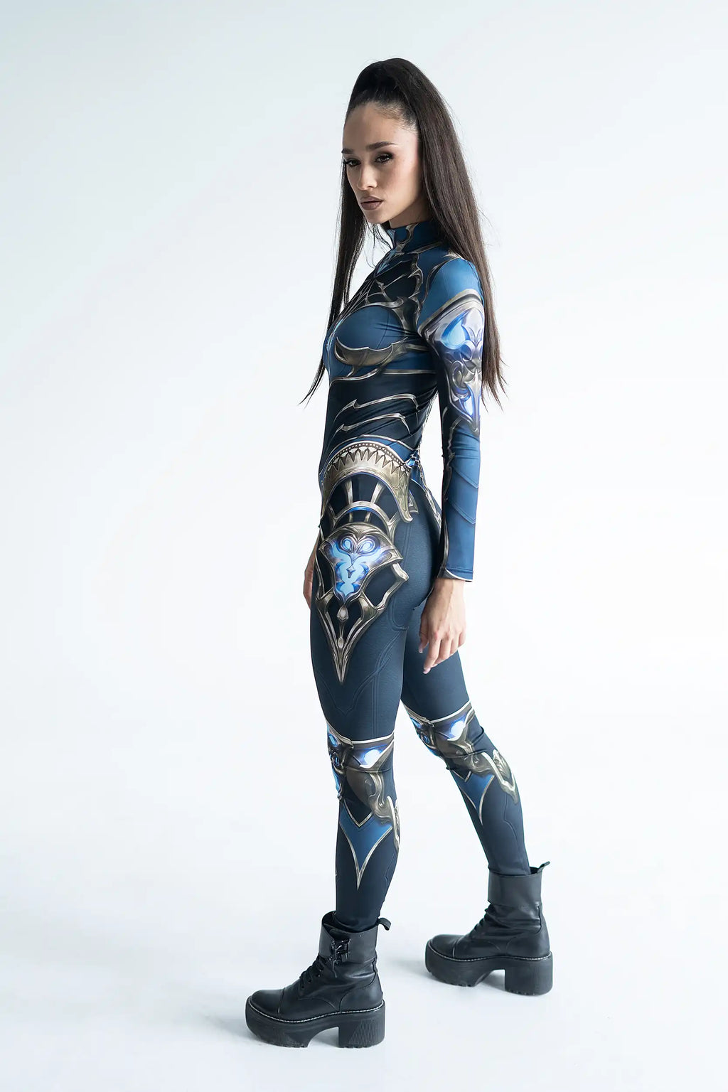 Person wearing a blue and gold Woman Armor outfit with intricate designs