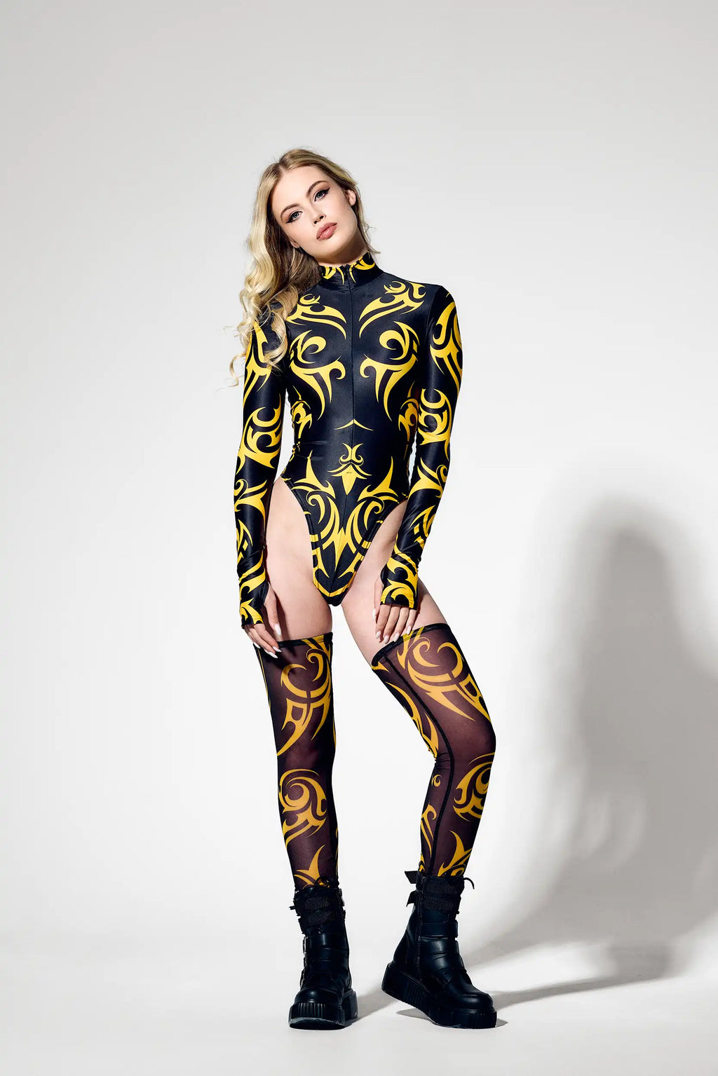 Cyber-inspired tribal bodysuit made from premium Italian lycra with sculpting fit.