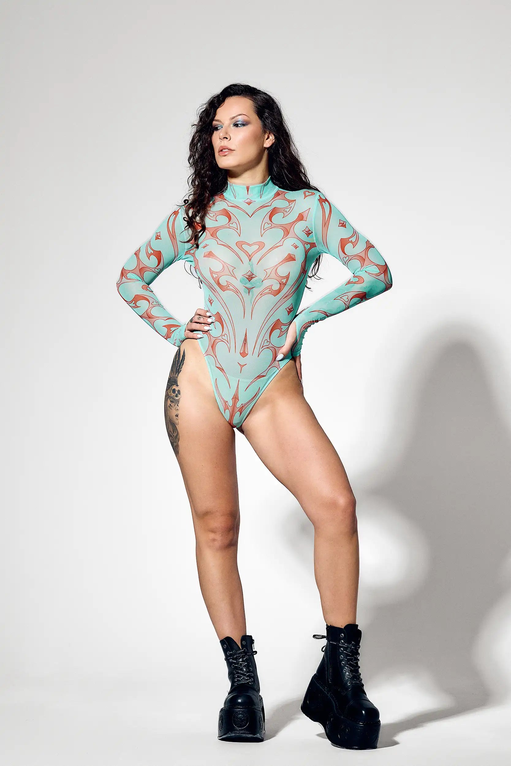 Seafoam tribal mesh bodysuit with coral graphics and futuristic cyber-inspired design