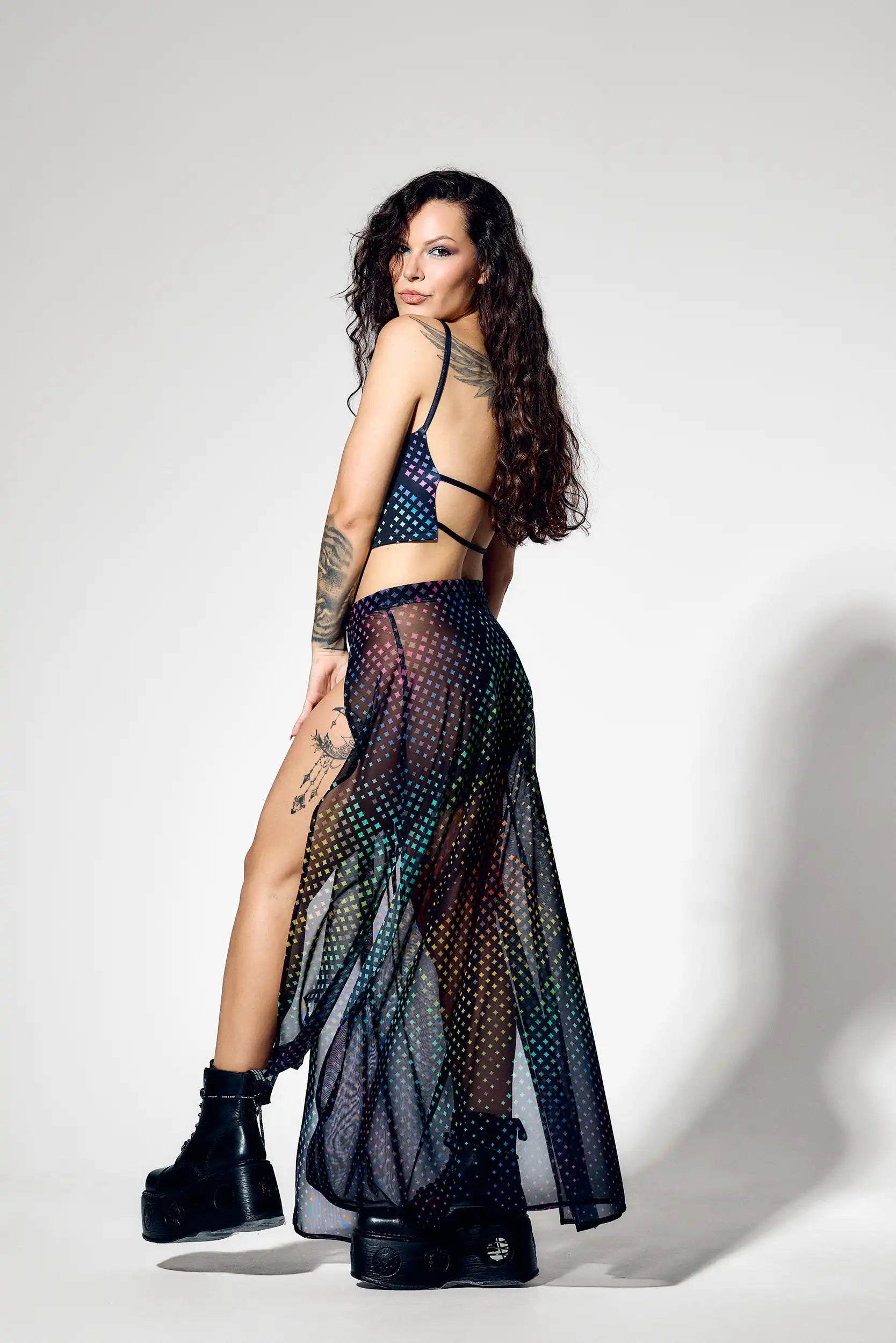 Open back rave crop top paired with high slit rainbow mesh skirt