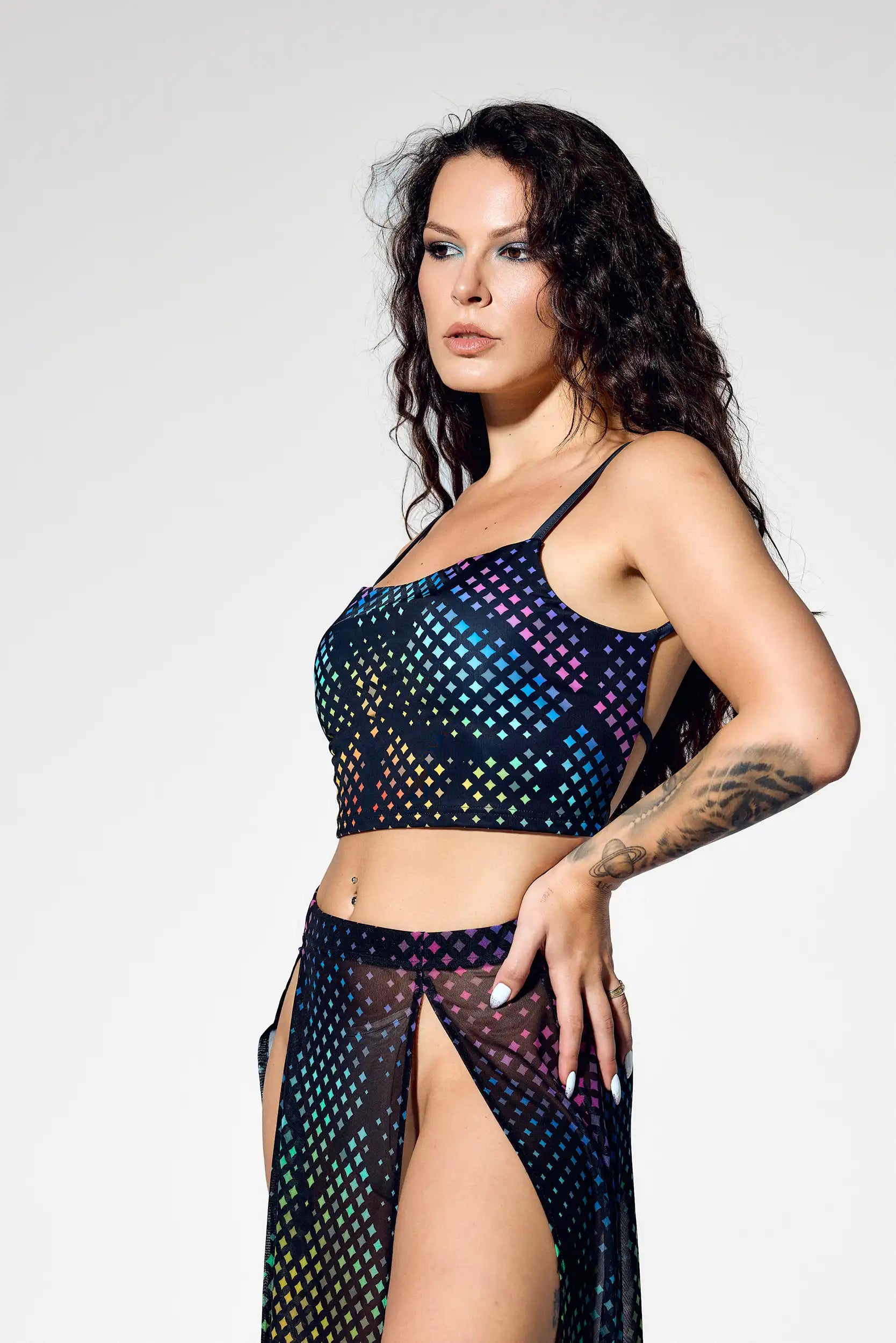 Open back rave crop top paired with high slit rainbow mesh skirt