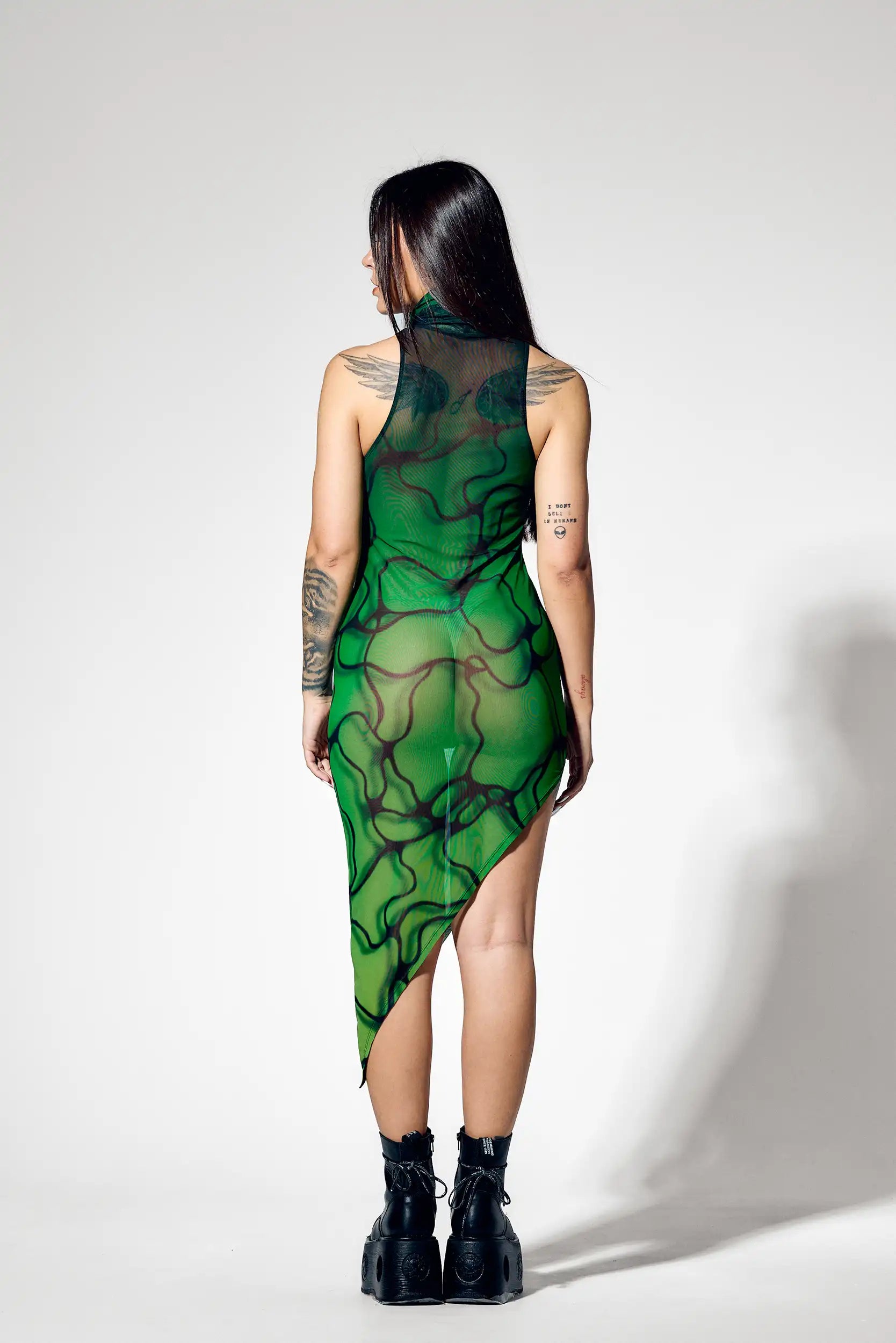 Back view of green sheer botanical mesh dress