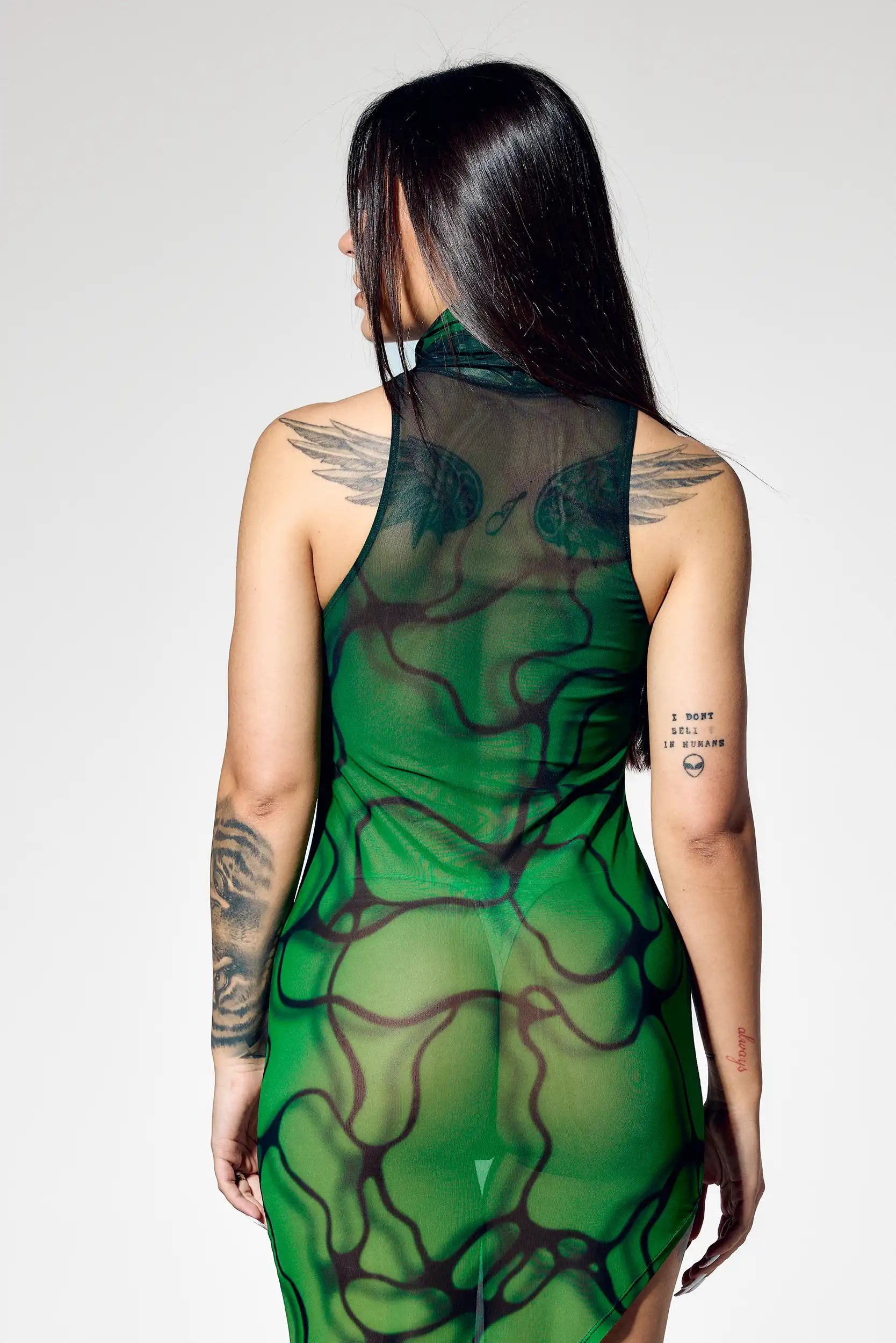Close-up of green sheer mesh and flowing black organic print