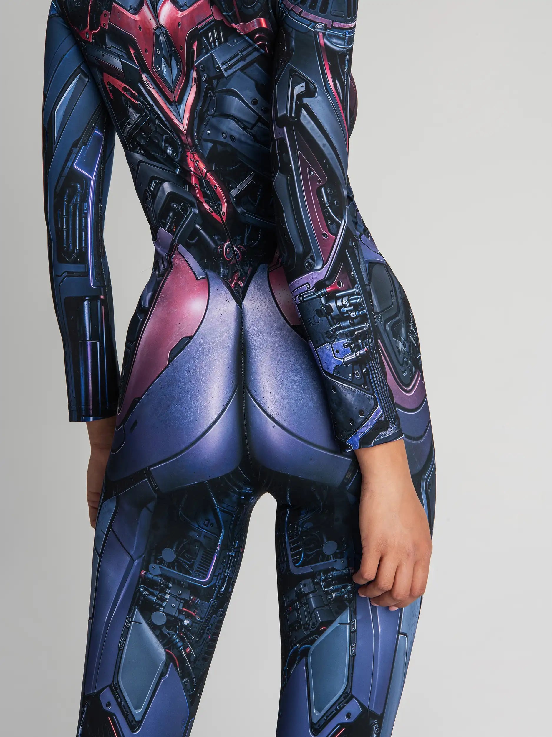 Close-up of a futuristic, sci-fi themed bodysuit with blue and red design on a gray background.