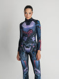 Person wearing a futuristic, form-fitting suit with mechanical design on a plain background